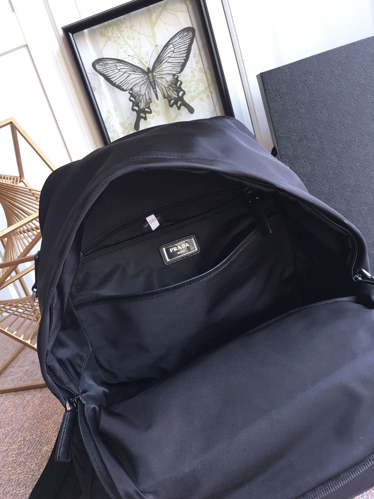 PRADA TRIANGLE LOGO BACKPACK 40 IN BLACK RE-NYLON