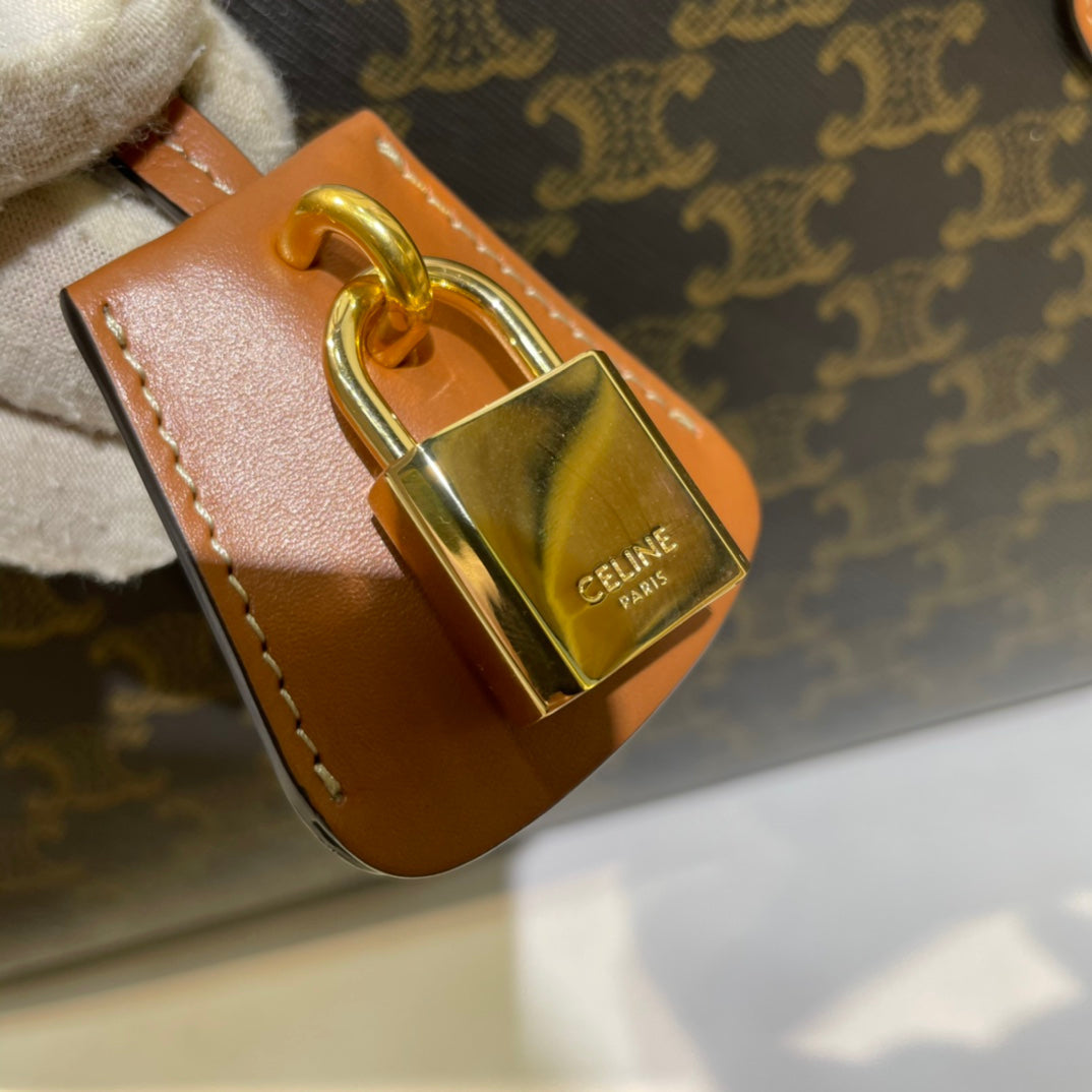 CELINE 25S HORIZONTAL CABAS 34MM IN BLACK TRIOMPHE CANVAS AND BROWN CALFSKIN